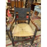 A stained wood carved armchair, two dining chairs, occasional tables and other small furniture.