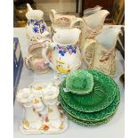 A collection of Wedgwood and other green leaf pattern plates, various jugs and other ceramics.