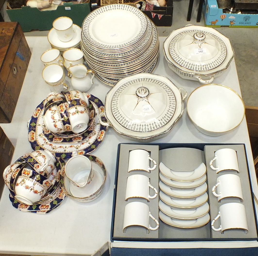 Six each Royal Worcester coffee cups and saucers, cream with gilt edge, in fitted box, twenty-