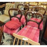 A set of four Victorian balloon-back dining chairs with upholstered seats, on turned front legs, (