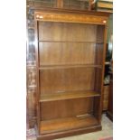 A reproduction inlaid mahogany tall bookcase, 110cm wide, 184cm high.