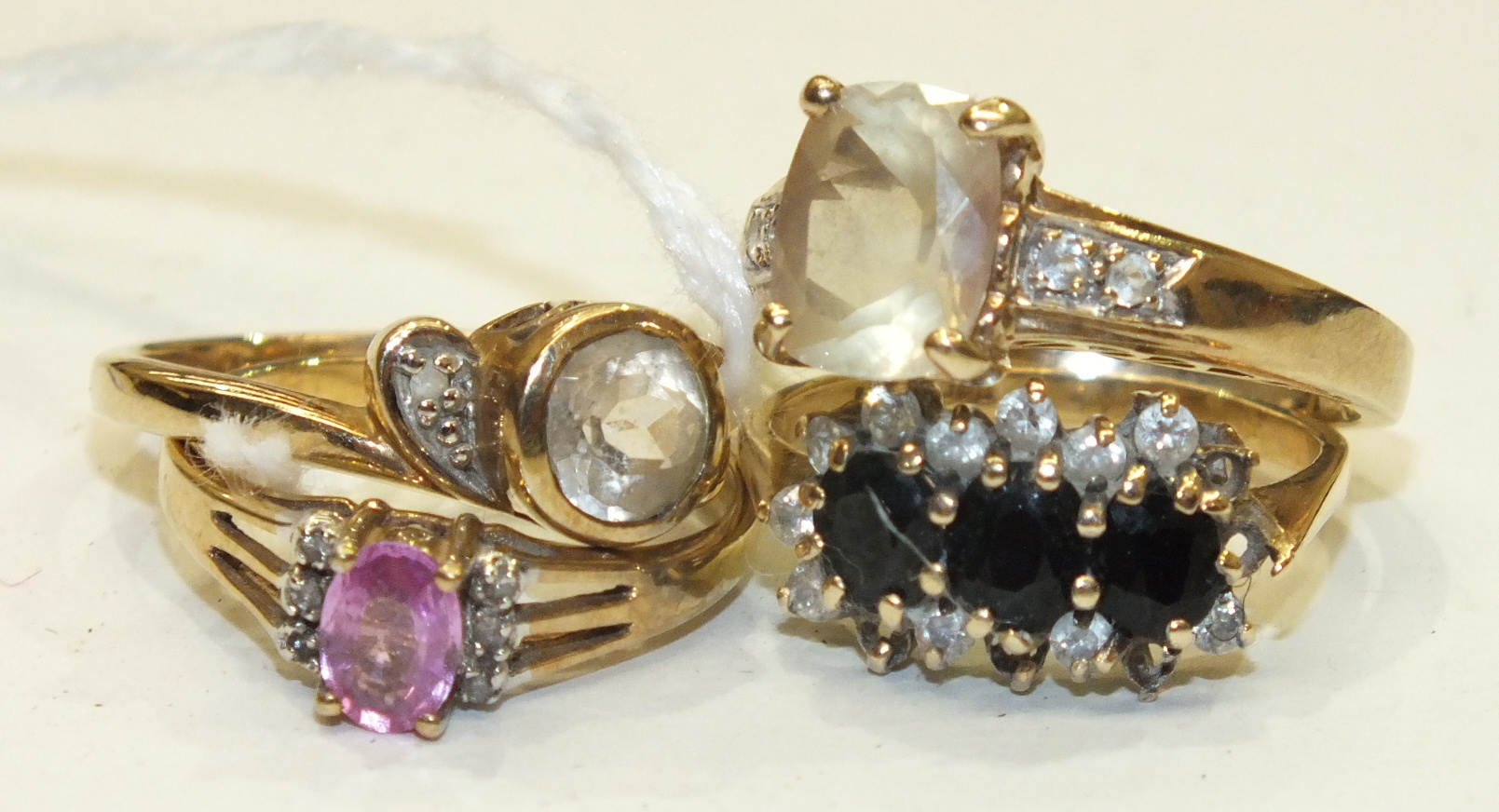 Four various 9ct gold gem-set rings, sizes K-N, gross weight 10g.