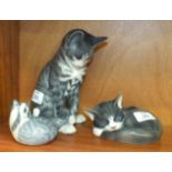 A collection of three Royal Copenhagen cat figures, including 'Grey Seated Cat' No.340, 19cm, 'Tabby