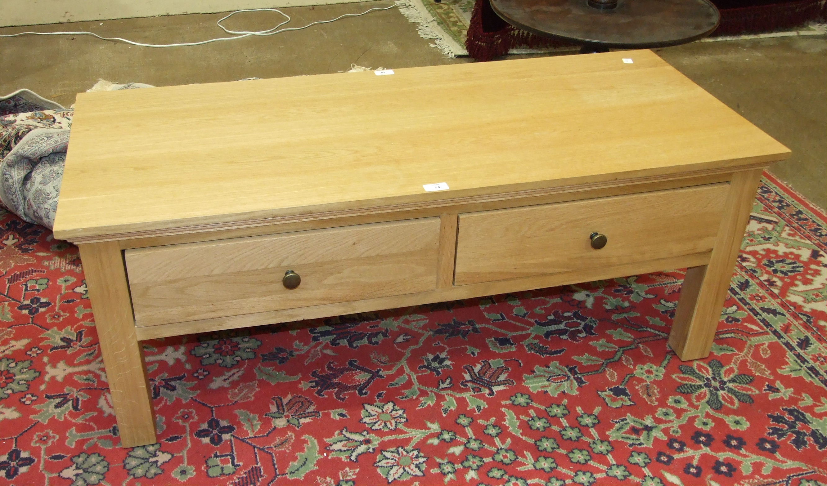 A modern oak rectangular coffee table.