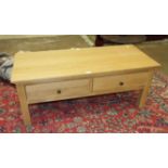 A modern oak rectangular coffee table.