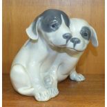 A Royal Copenhagen figure group of two pointer puppies No.260, 14.5cm high.