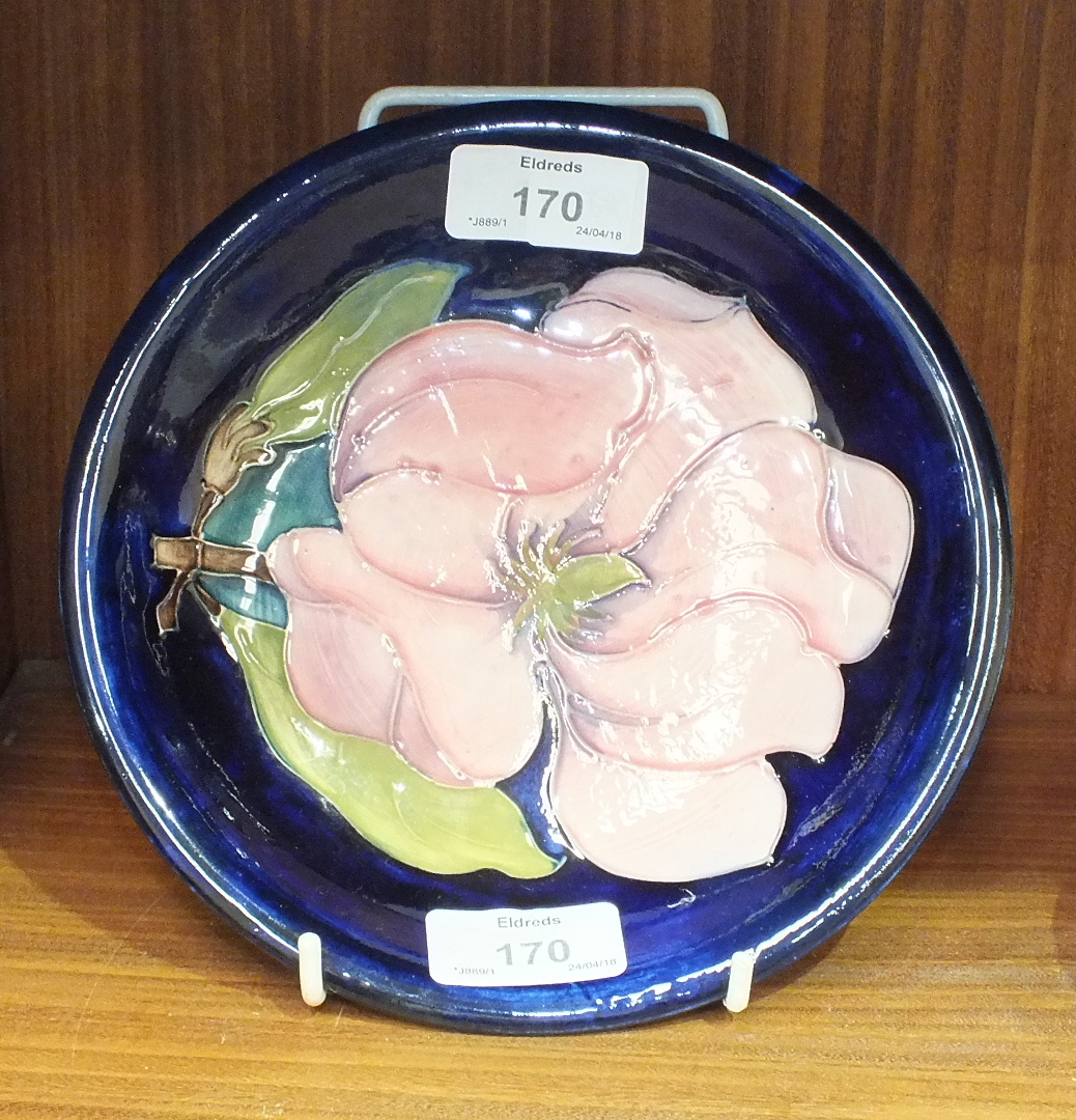 A Moorcroft shallow bowl with tubeline decoration of a magnolia flower on a blue ground, 18.5cm - Image 2 of 3