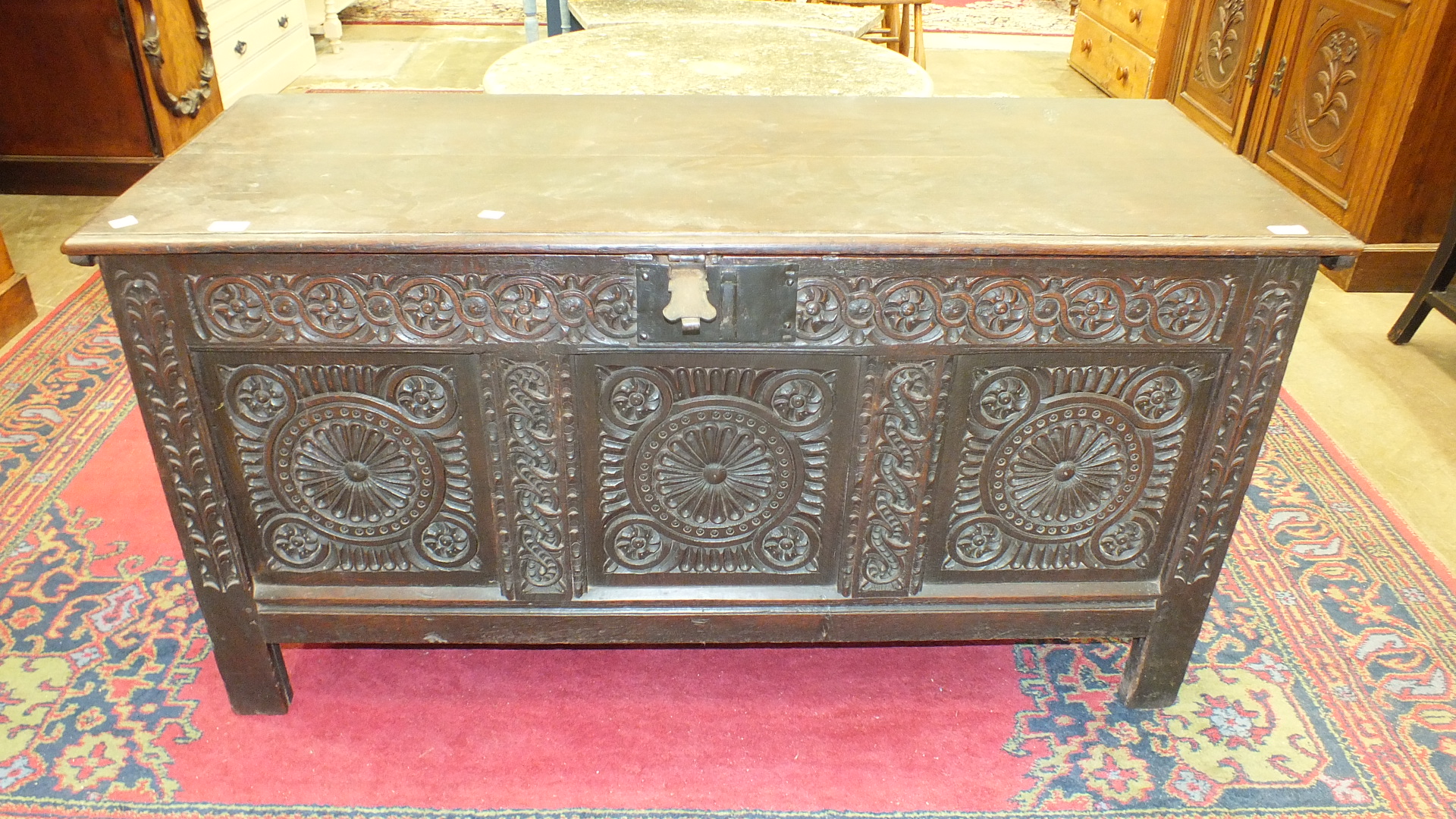 An antique oak coffer with carved panel front, 140cm wide. - Image 2 of 13