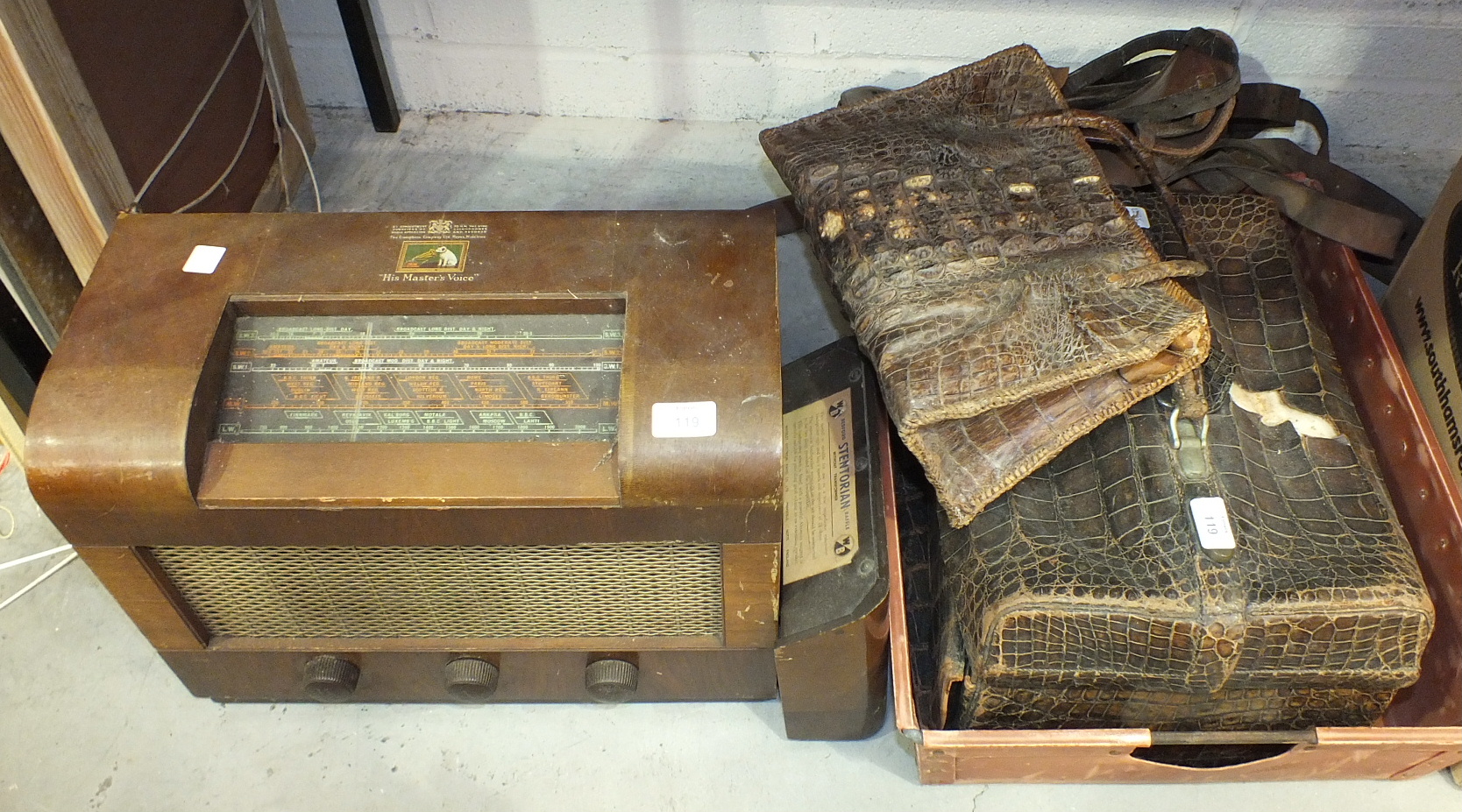 An HMV model No.1120 wooden-cased vintage valve radio, (a/f), a reptile skin Gladstone bag, (a/f)