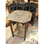 An oak two-tier occasional table carved with flowers and Eton School coat of arms and motto