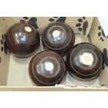 A set of four bowling woods by Thomas Taylor, Glasgow and a stained mahogany dressing glass, (2).