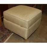 A modern upholstered Ottoman stool on castors, 53cm square.