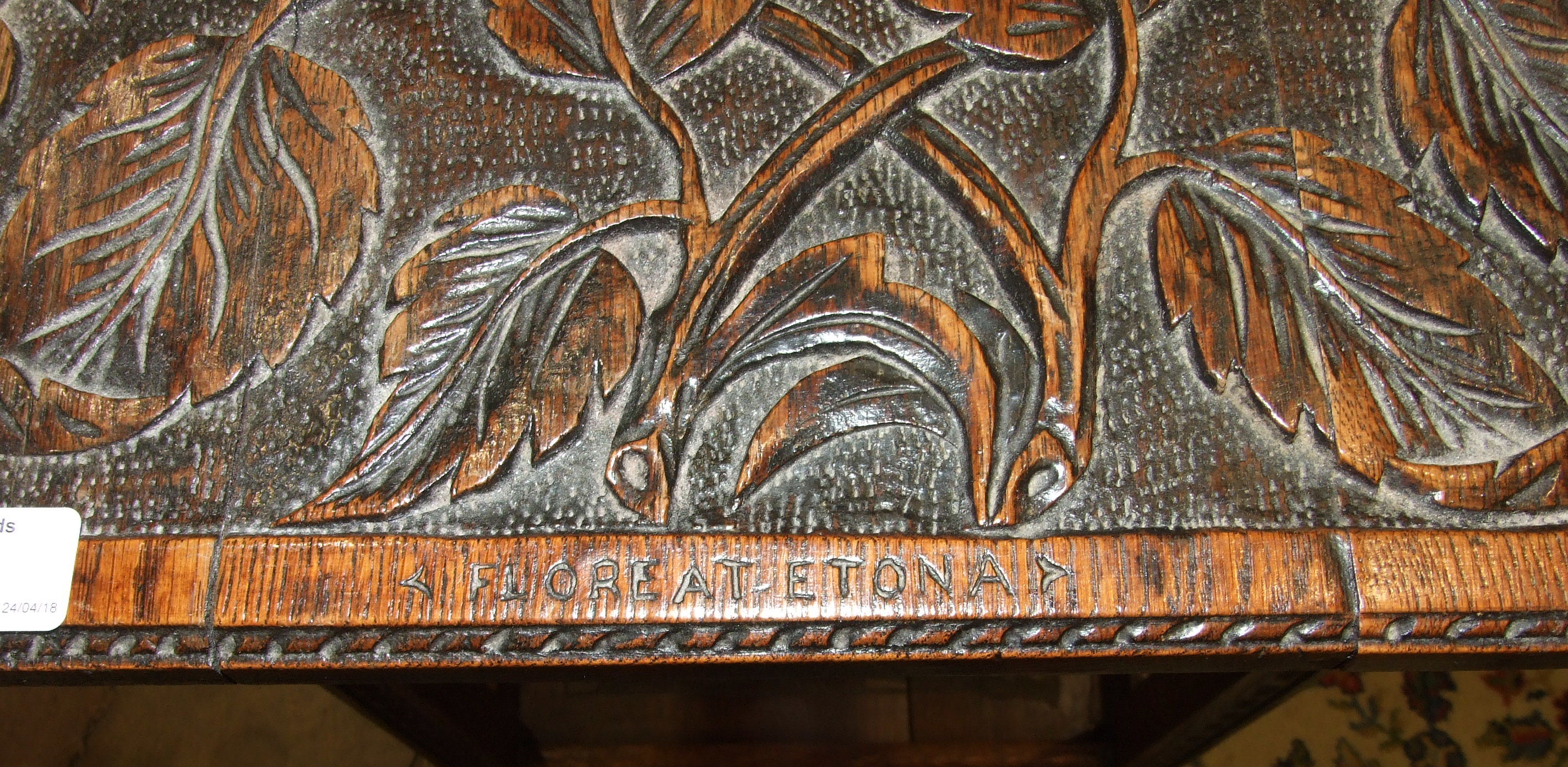 An oak two-tier occasional table carved with flowers and Eton School coat of arms and motto - Image 2 of 3