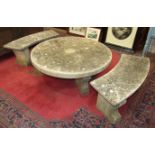 A minster stone circular low garden table, 116cm diameter, together with two minster stone curved