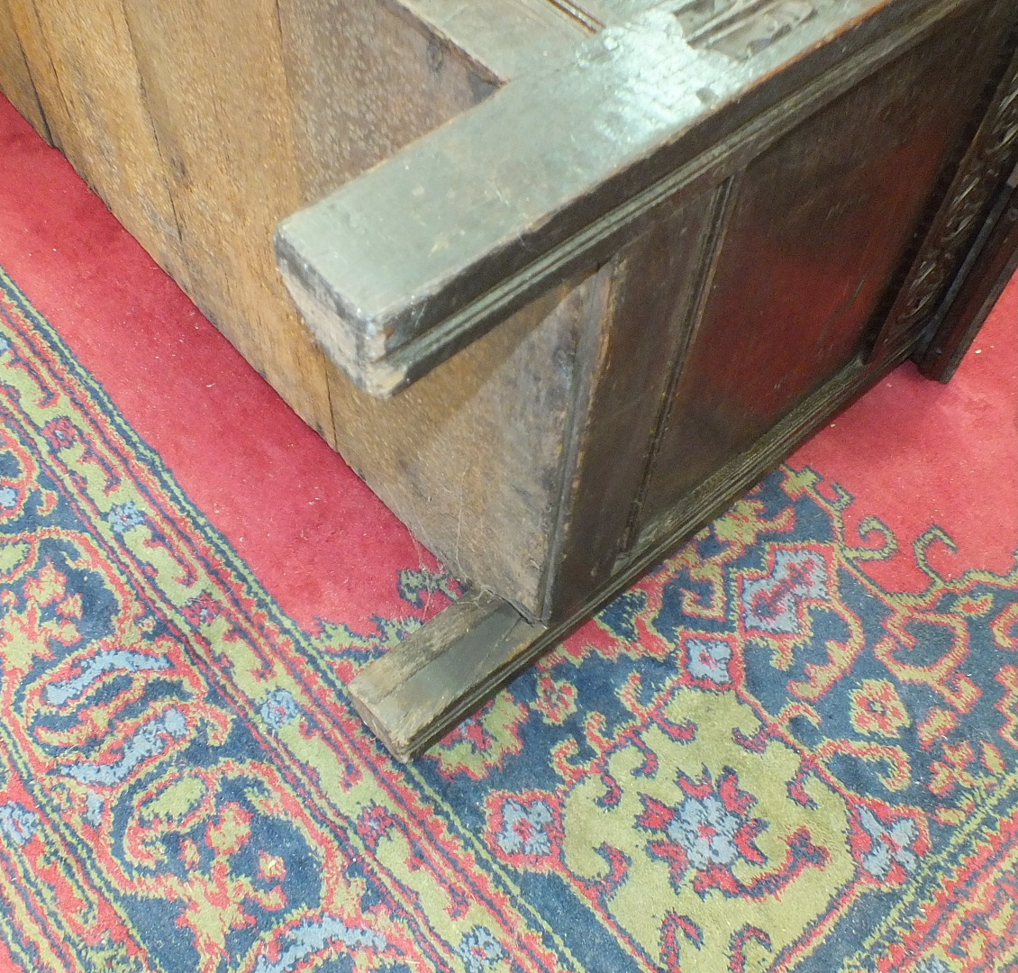 An antique oak coffer with carved panel front, 140cm wide. - Image 13 of 13
