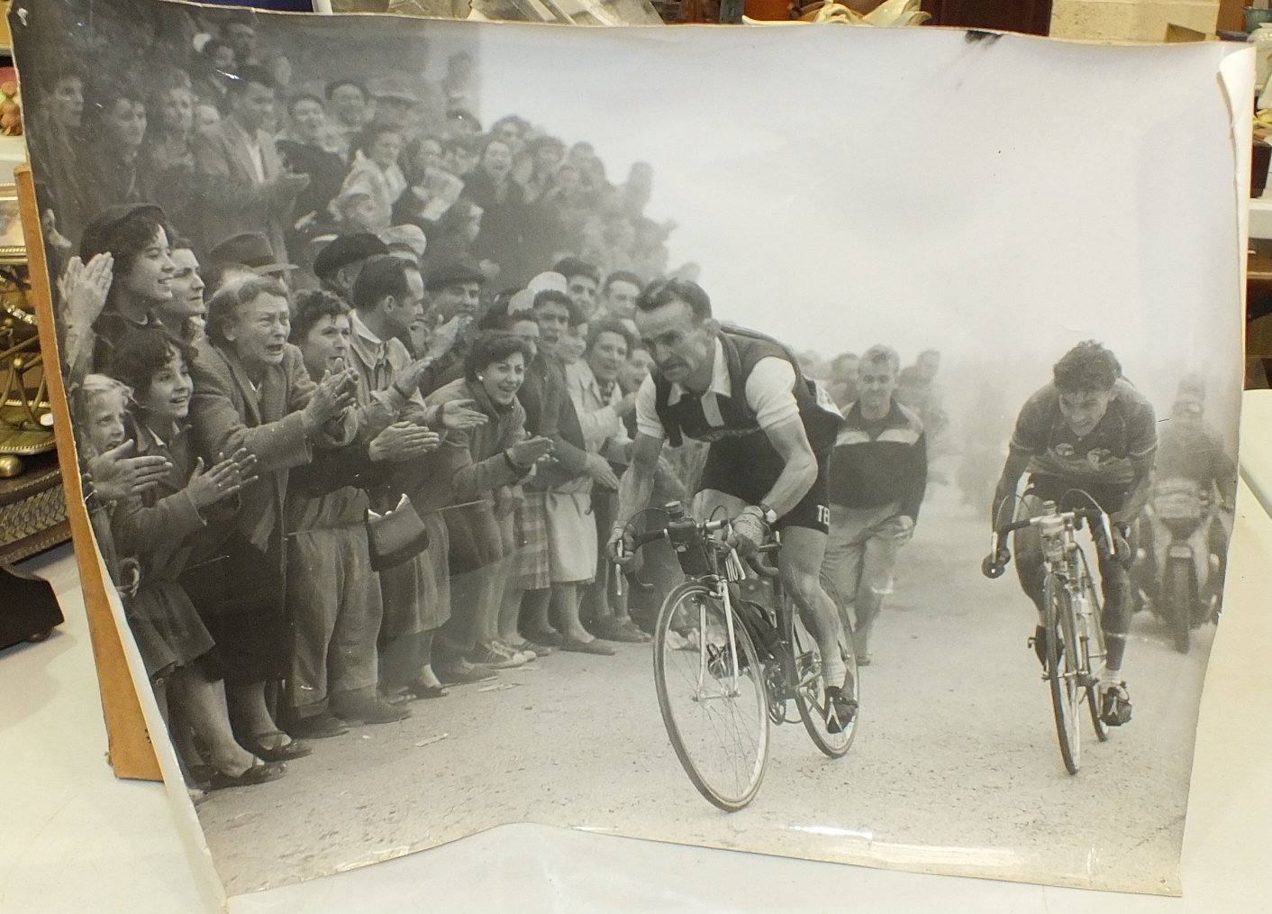 Two large photographs of cycling interest, a Cassells illustrated family bible and other items.