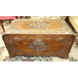 A mid-20th century camphor wood chest, the sides and lid with carved decoration, 93cm wide, 47cm