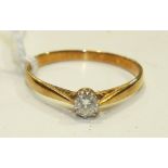 A solitaire diamond ring, the brilliant-cut diamond of 0.2cts in 18ct yellow gold and platinum