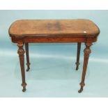 A Victorian burr walnut card table, the fold-over top with metal beaded border raised on carved