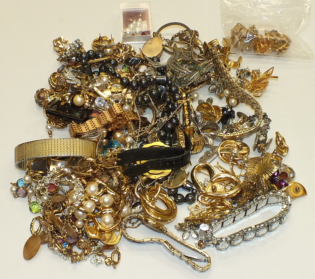 A quantity of costume jewellery including earrings by Trifari and monet, watches and two jewellery