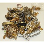 A quantity of costume jewellery including earrings by Trifari and monet, watches and two jewellery