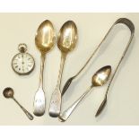 A pair of silver Exeter sugar tongs, a .800 fob watch and four other silver spoons.