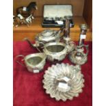 A cased silver three-piece cruet set, Birmingham 1923, ___3oz, a three-piece plated tea service, a