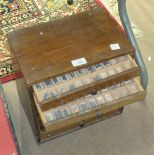 A quantity of metal printing type contained in a small wooden eight-drawer chest, 31.5cm wide, 32.