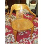 An early-20th century oak office armchair with Goodalls Furnishers & Decorators, Manchester