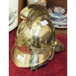 A reproduction fireman's brass helmet.