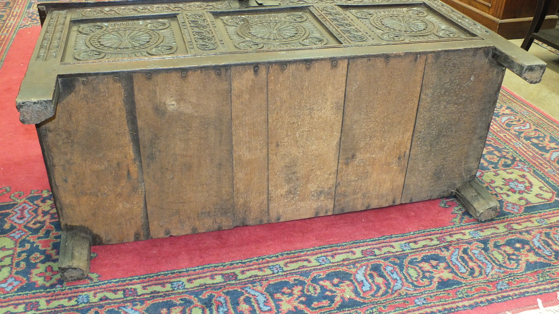 An antique oak coffer with carved panel front, 140cm wide. - Image 11 of 13