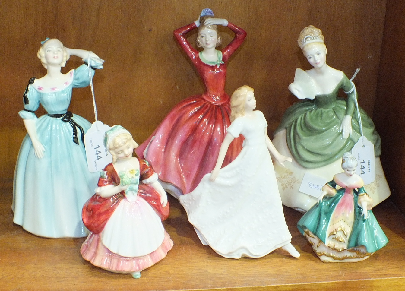 A collection of six Royal Doulton figurines, 'Celeste' HN2237, 'Katrina' NH2327, 'Soirée' HN2312, '