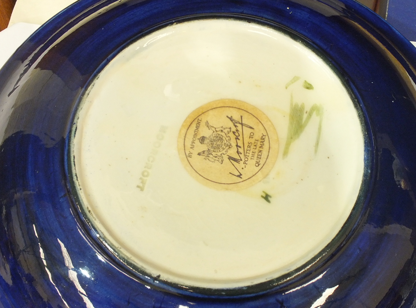 A Moorcroft shallow bowl with tubeline decoration of a magnolia flower on a blue ground, 18.5cm - Image 3 of 3