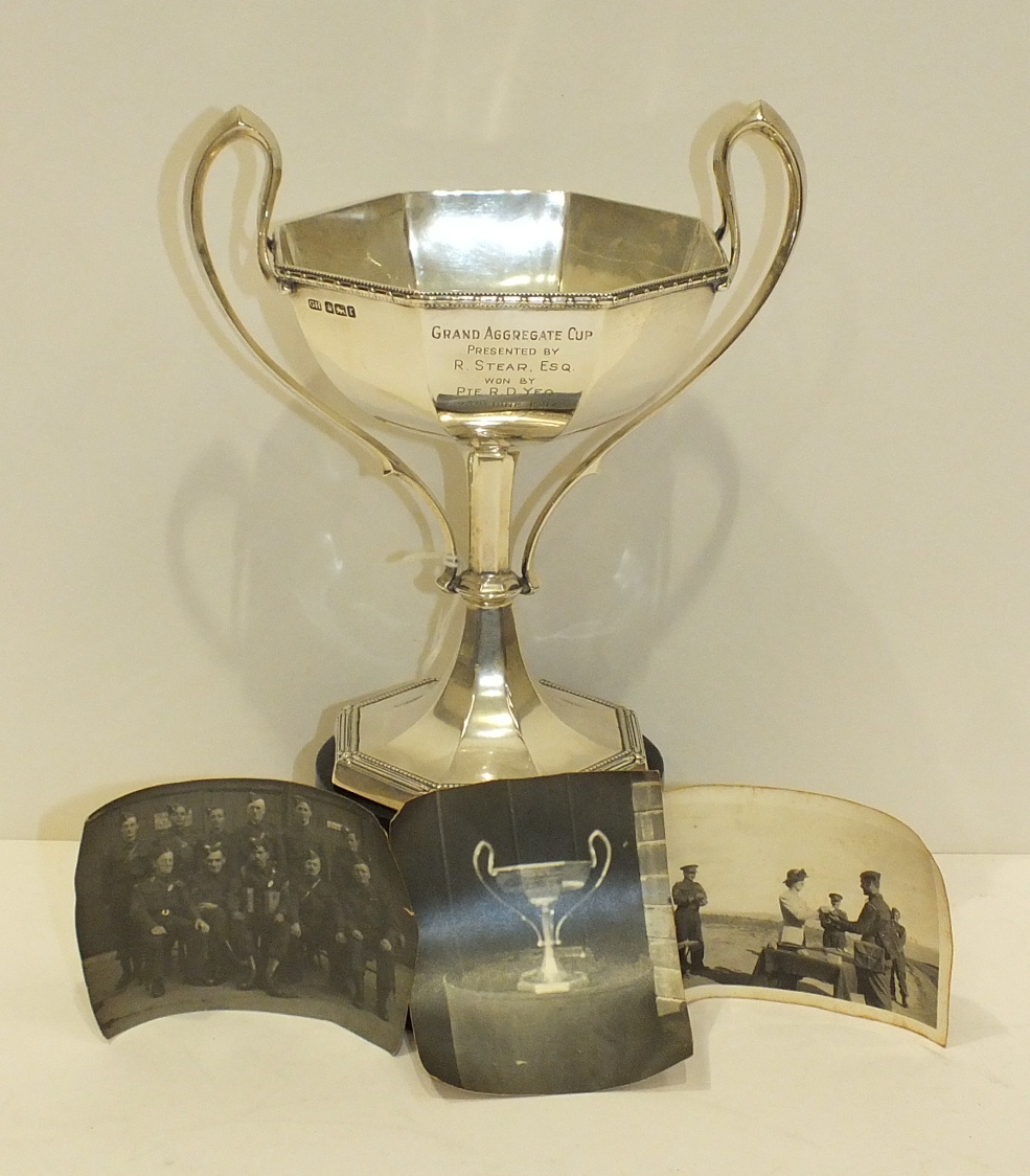 A silver two-handled trophy cup of octagonal form, on octagonal foot, 18.5cm high, Sheffield 1934,