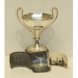 A silver two-handled trophy cup of octagonal form, on octagonal foot, 18.5cm high, Sheffield 1934,