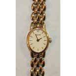 Accurist, a ladies wrist watch with 9ct gold oval case and integral bracelet, total weight 16g.