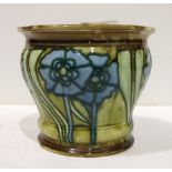 A Minton Secessionist small jardinière decorated with tubeline blue stylised flowers, on a green and