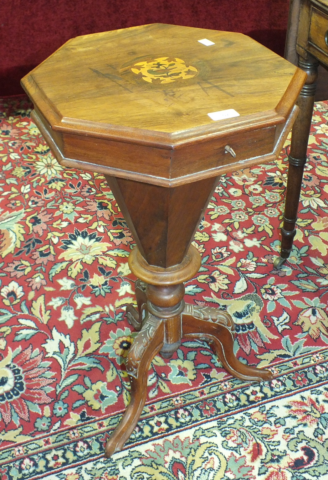 A Victorian walnut octagonal sewing table on carved tripod supports and a 20th century mahogany oval