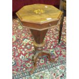 A Victorian walnut octagonal sewing table on carved tripod supports and a 20th century mahogany oval
