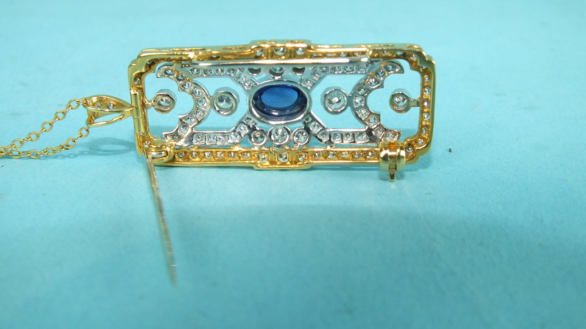 An Art-Deco-style sapphire and diamond brooch pendant centrally-set a cabochon sapphire in a - Image 2 of 2