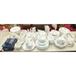 Approximately one hundred pieces of Aynsley 'Cottage Garden' decorated tea and dinner ware, bowls,