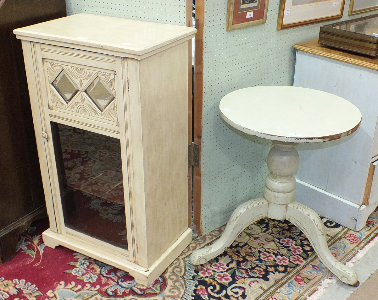 A small painted cupboard fitted with a single glazed door, 54cm wide, 91cm high and a painted