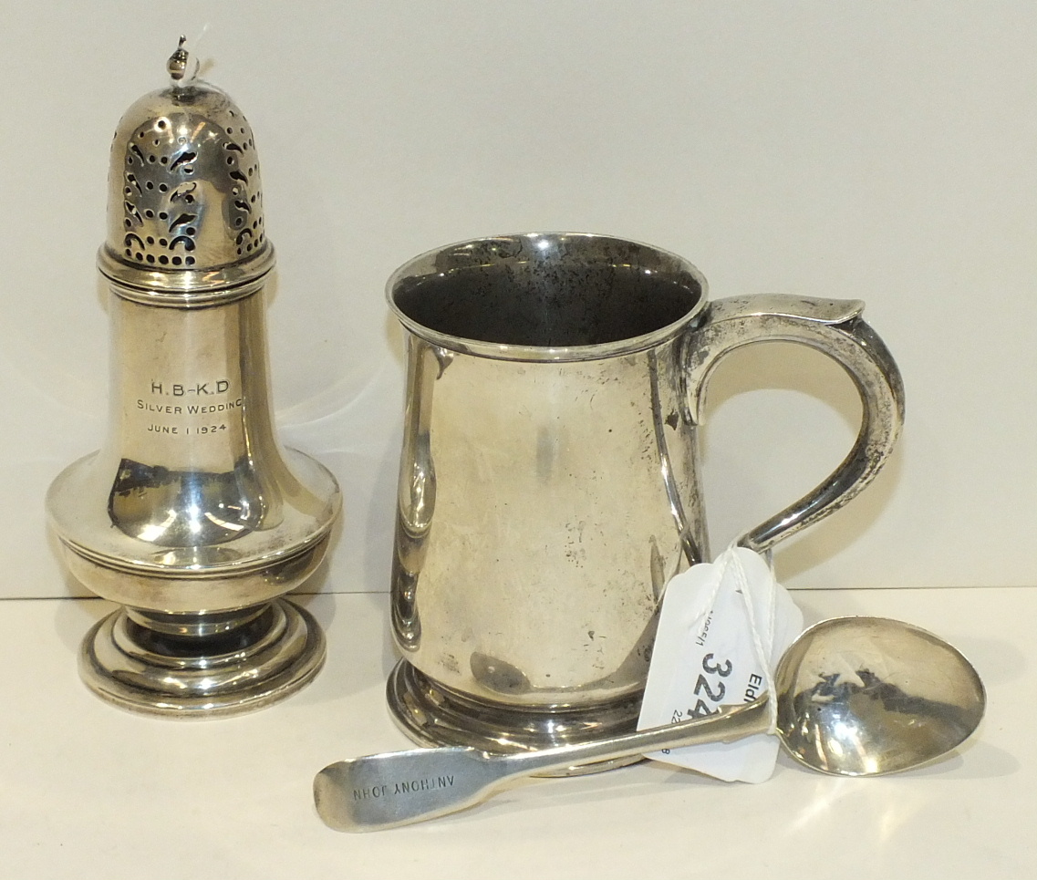 A small silver tankard, 9.5cm, London 1943, ___6½oz, a plain sugar castor, marks rubbed and a silver