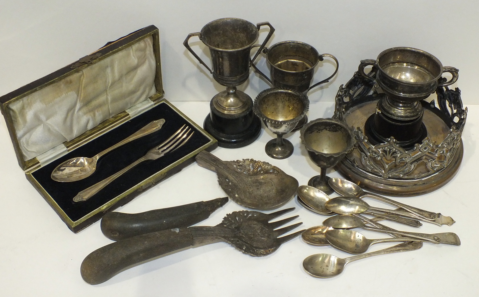 Three small silver two-handled trophy cups, Birmingham 1930, 1932, 1941, 2x 9.5cm, 1x 5.5cm, eight