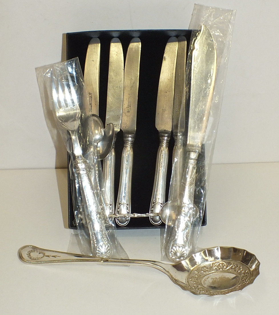 Five silver-handled knives, three silver teaspoons and various plated ware.