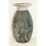 A Poole Pottery Atlantis vase by Jenny Haigh, of ovoid form with flared rim, the body with incised