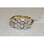 A diamond cluster ring claw-set seventeen brilliant-cut diamonds, in 18ct yellow and white gold