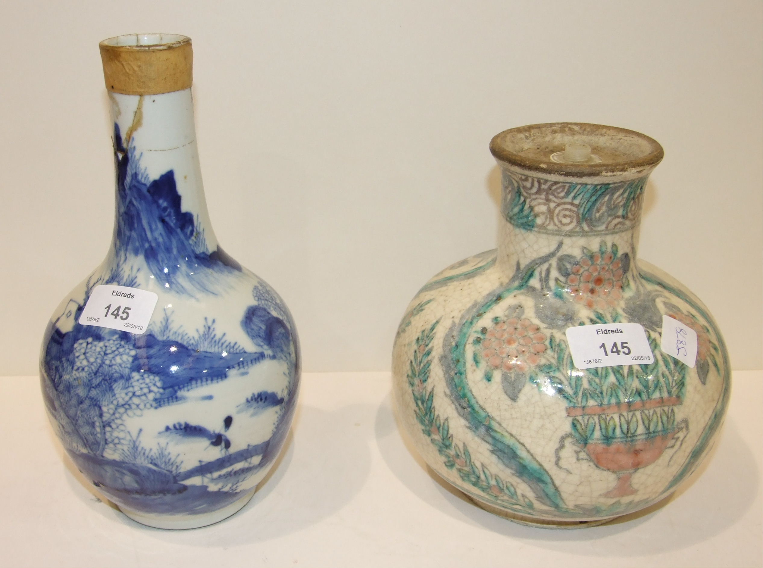 A 19th century Chinese blue and white bottle vase, (damages), 24cm and another, both converted to