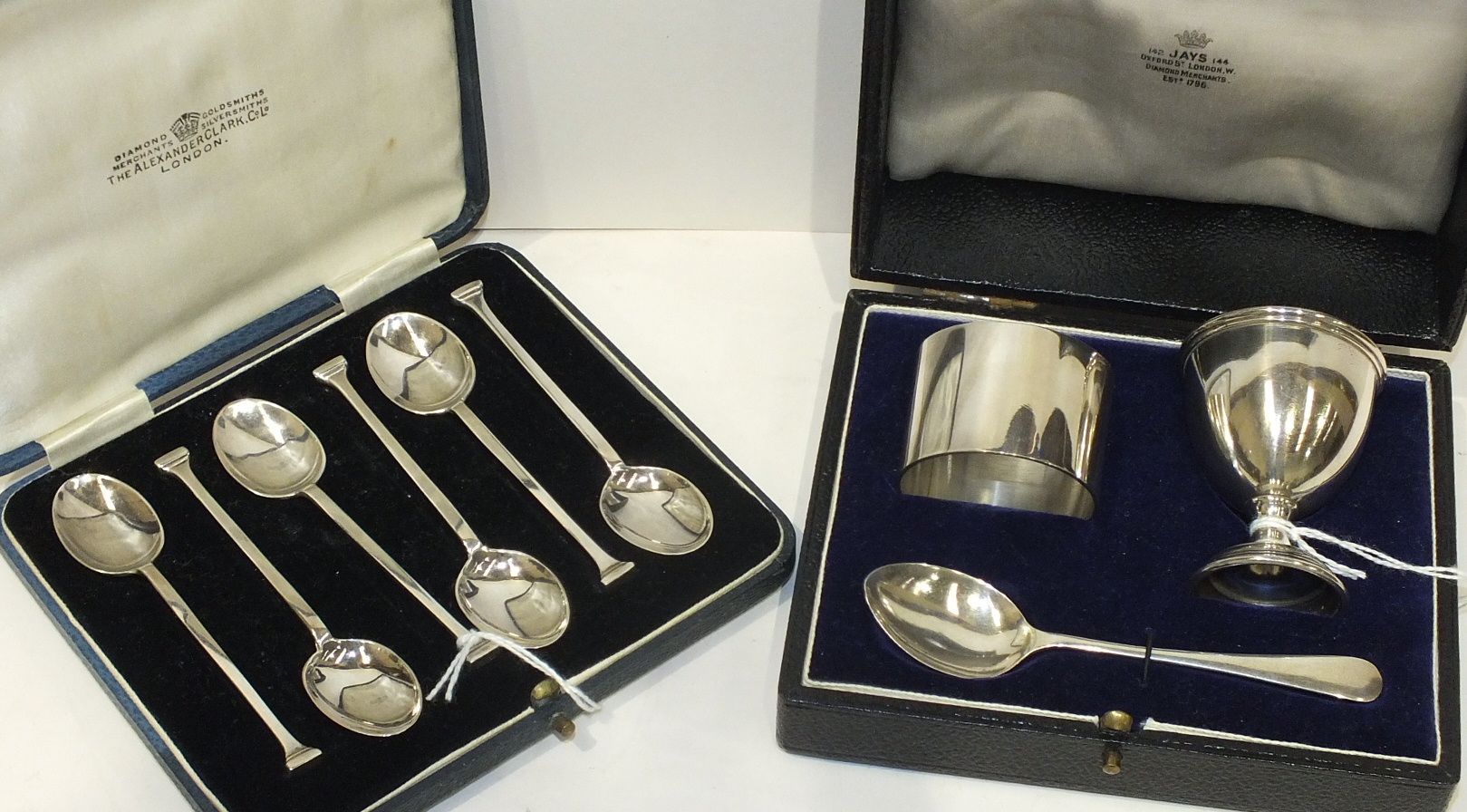 A modern silver napkin ring, egg cup and spoon, in fitted box, together with a set of six coffee