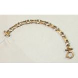 A 9ct white and yellow gold fancy-link bracelet with large bolt-ring clasp, 12.9g.